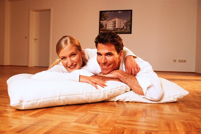 Young couple in an empty flat.